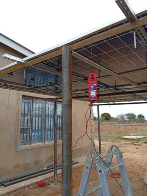 Checking the panel strings with a clamp meter before connecting